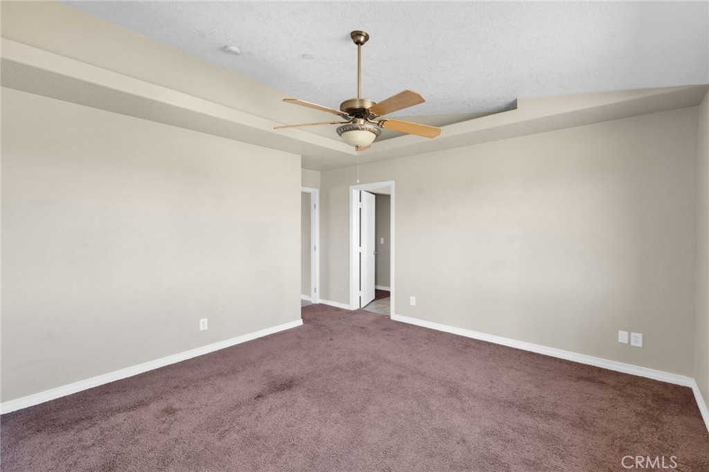 12865 Barbet Road Phelan, CA 92371 - Photo 26 of 51 a view of a chandelier fan in a room