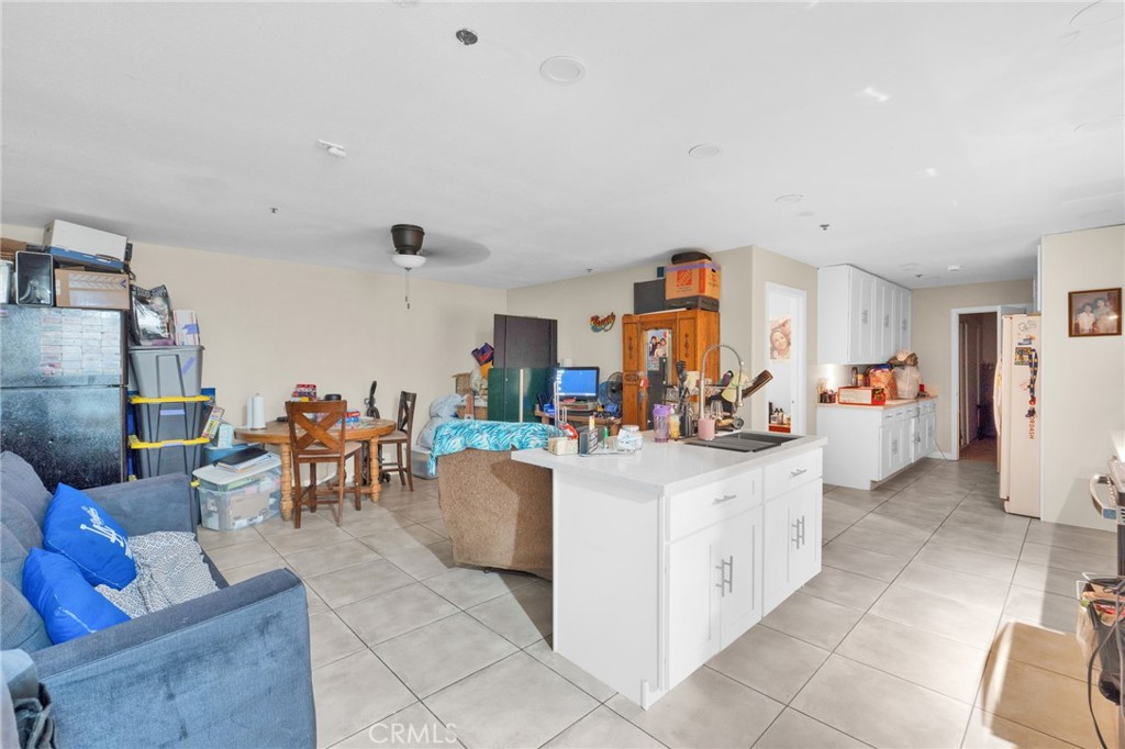 12865 Barbet Road Phelan, CA 92371 - Photo 31 of 51 a view of a living room and dining room