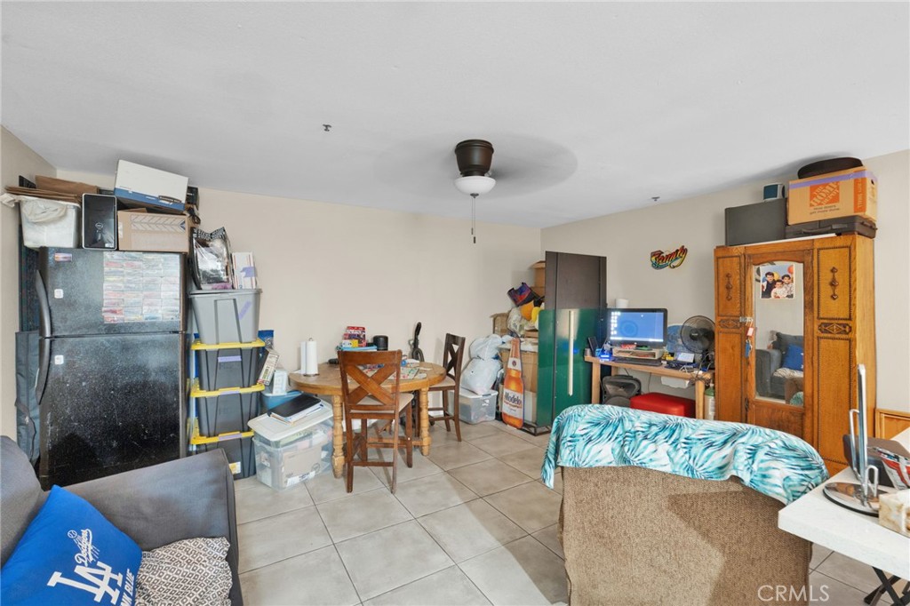 12865 Barbet Road Phelan, CA 92371 - Photo 32 of 51 a living room with furniture and a flat screen tv