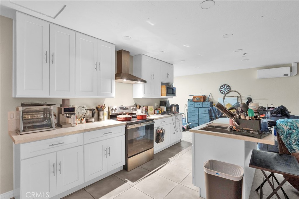 12865 Barbet Road Phelan, CA 92371 - Photo 34 of 51 a kitchen with a sink appliances and cabinets
