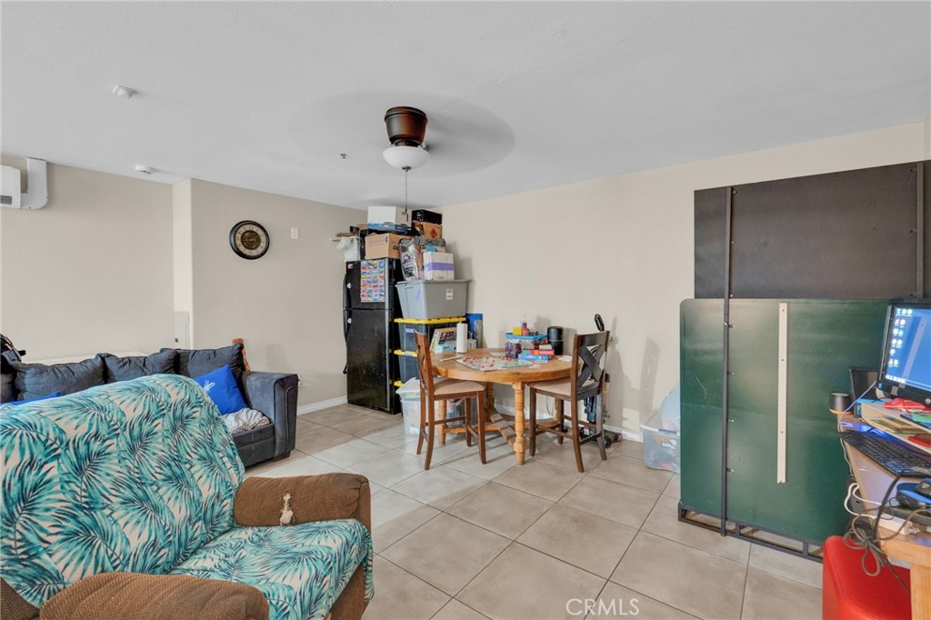 12865 Barbet Road Phelan, CA 92371 - Photo 36 of 51 a living room with furniture and a dining table