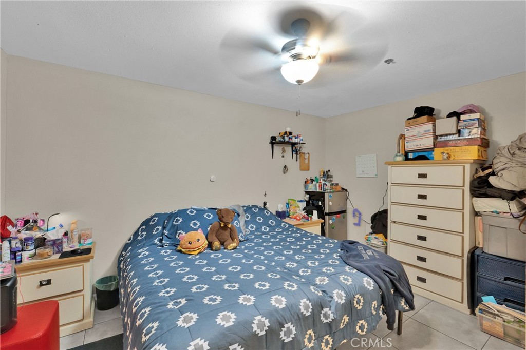 12865 Barbet Road Phelan, CA 92371 - Photo 38 of 51 a bedroom with a bed and dresser