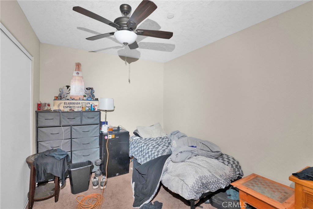12865 Barbet Road Phelan, CA 92371 - Photo 41 of 51 a view of a workspace with furniture and a fan
