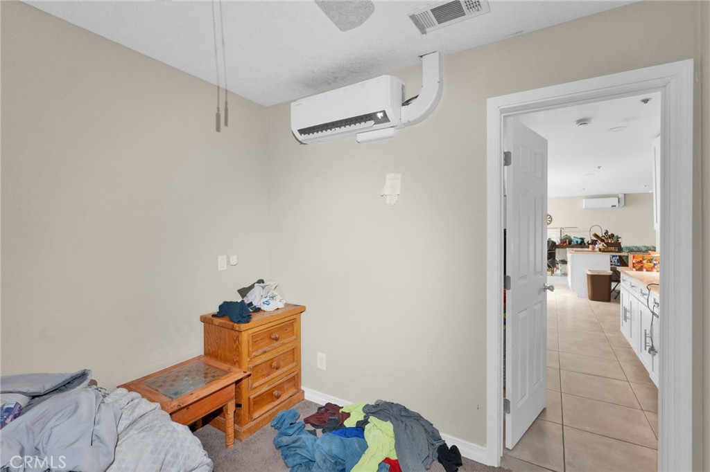 12865 Barbet Road Phelan, CA 92371 - Photo 42 of 51 a room with furniture and gym equipment