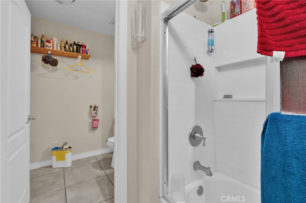 12865 Barbet Road Phelan, CA 92371 - Photo 43 of 51 a bathroom with a tub shower and a sink