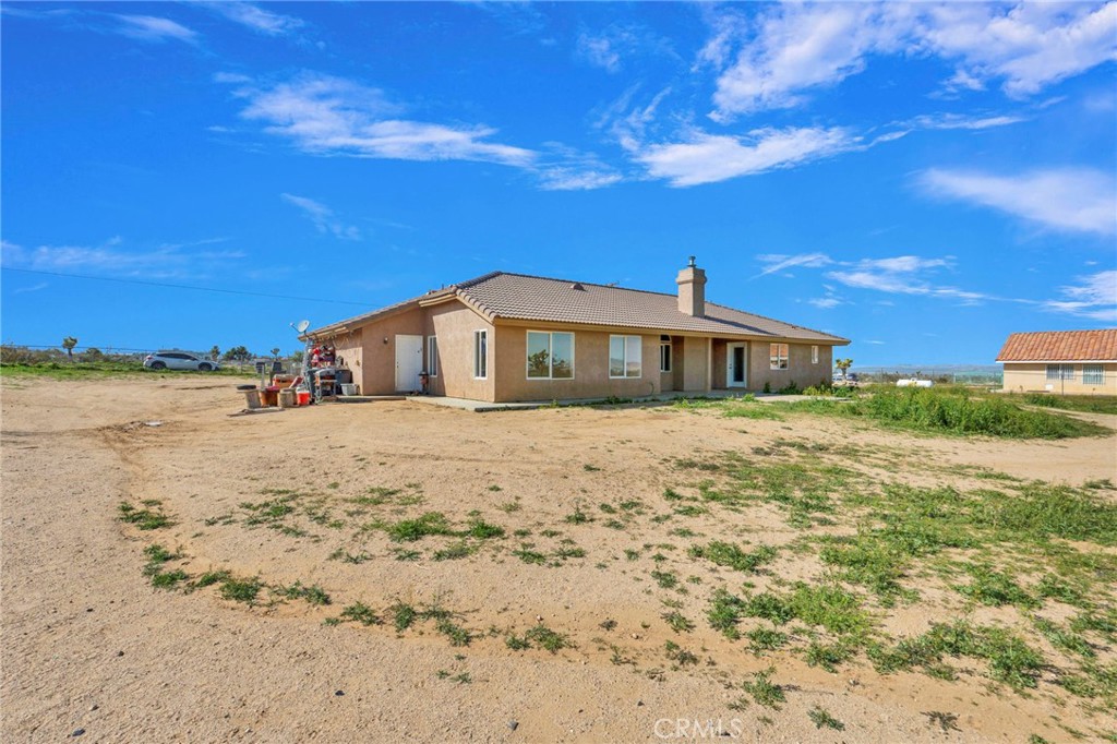 12865 Barbet Road Phelan, CA 92371 - Photo 46 of 51 a front view of a house with a yard