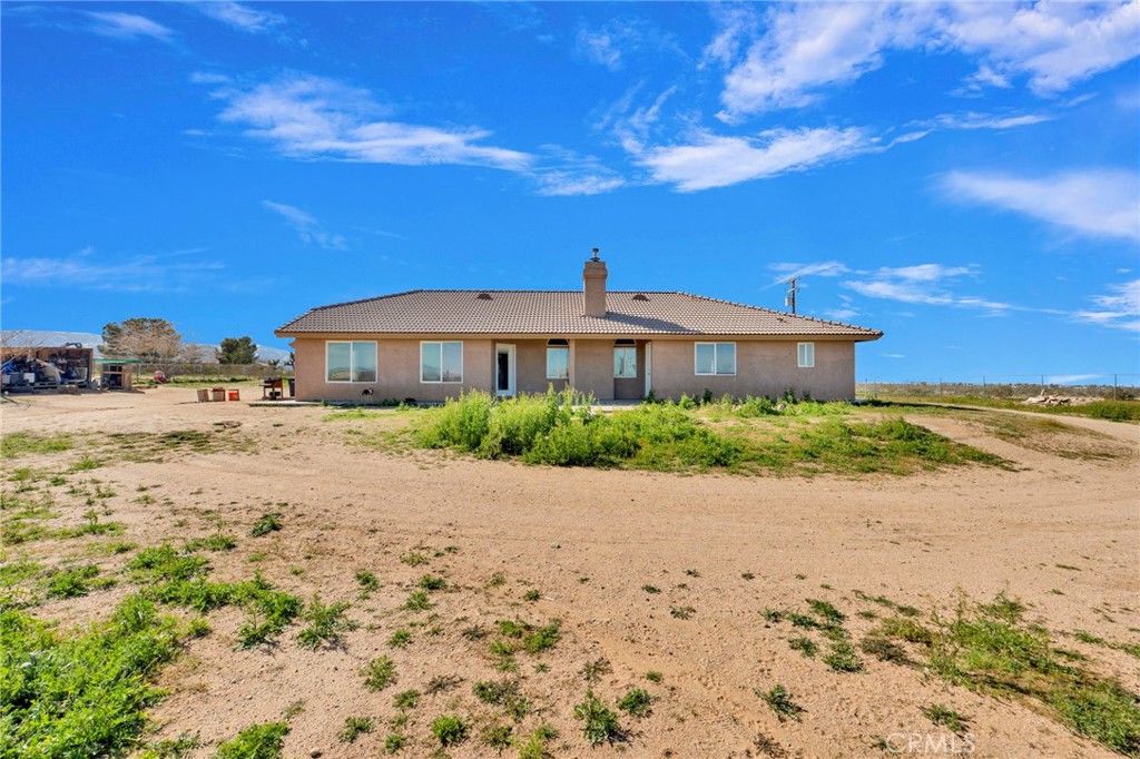 12865 Barbet Road Phelan, CA 92371 - Photo 47 of 51 a front view of a house with a yard