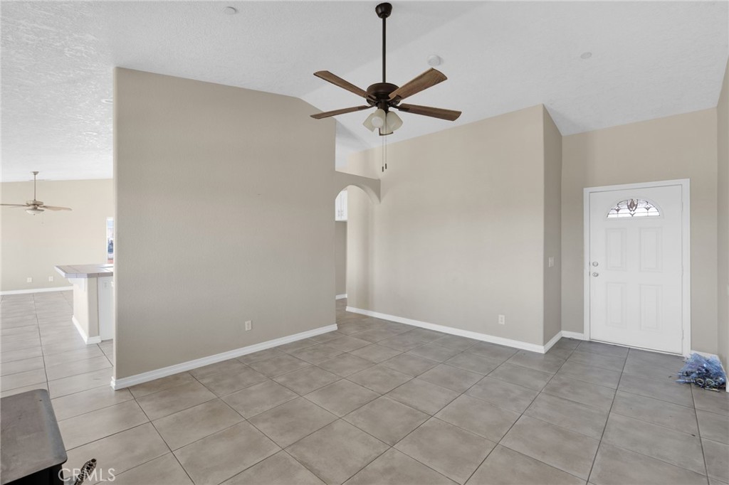12865 Barbet Road Phelan, CA 92371 - Photo 7 of 51 a view of an empty room with a fan