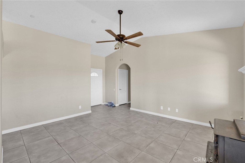 12865 Barbet Road Phelan, CA 92371 - Photo 8 of 51 an empty room with windows and fan