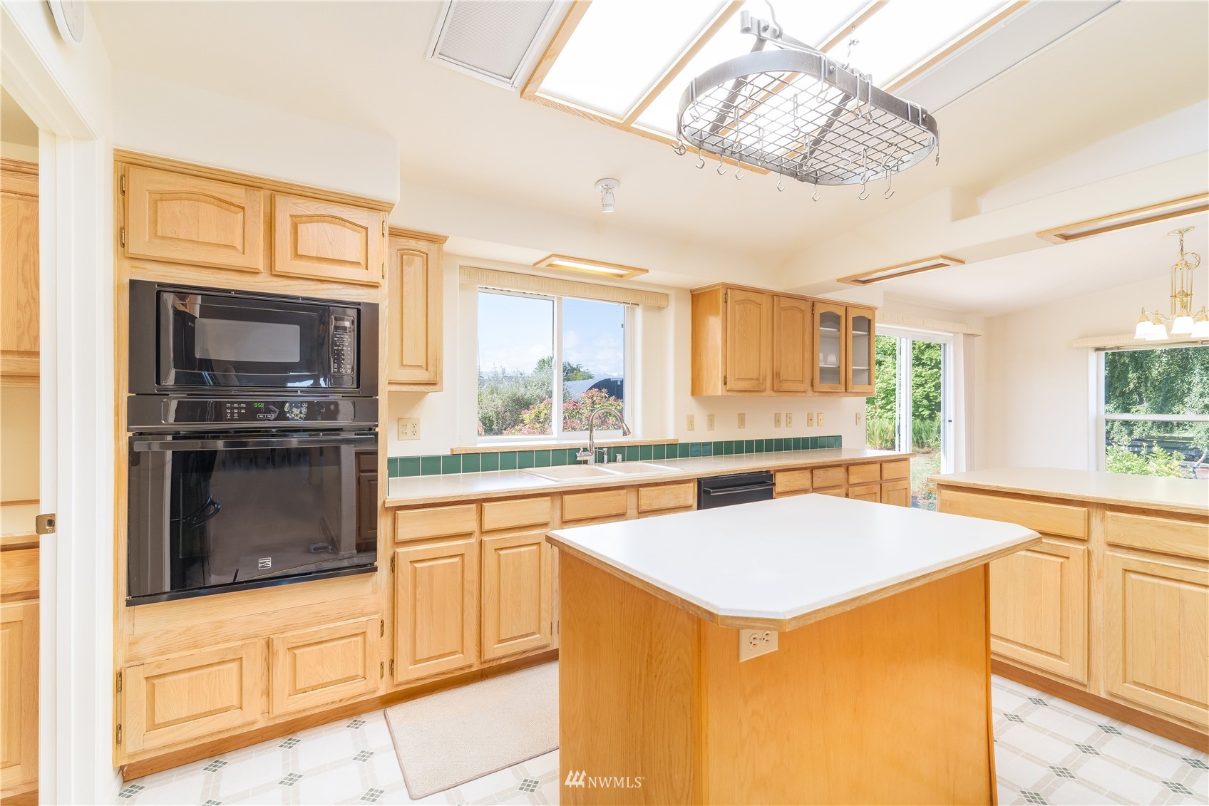 2192 Finn Hall Road Port Angeles, WA 98362 - Photo 12 of 40 a kitchen that has a sink and a stove