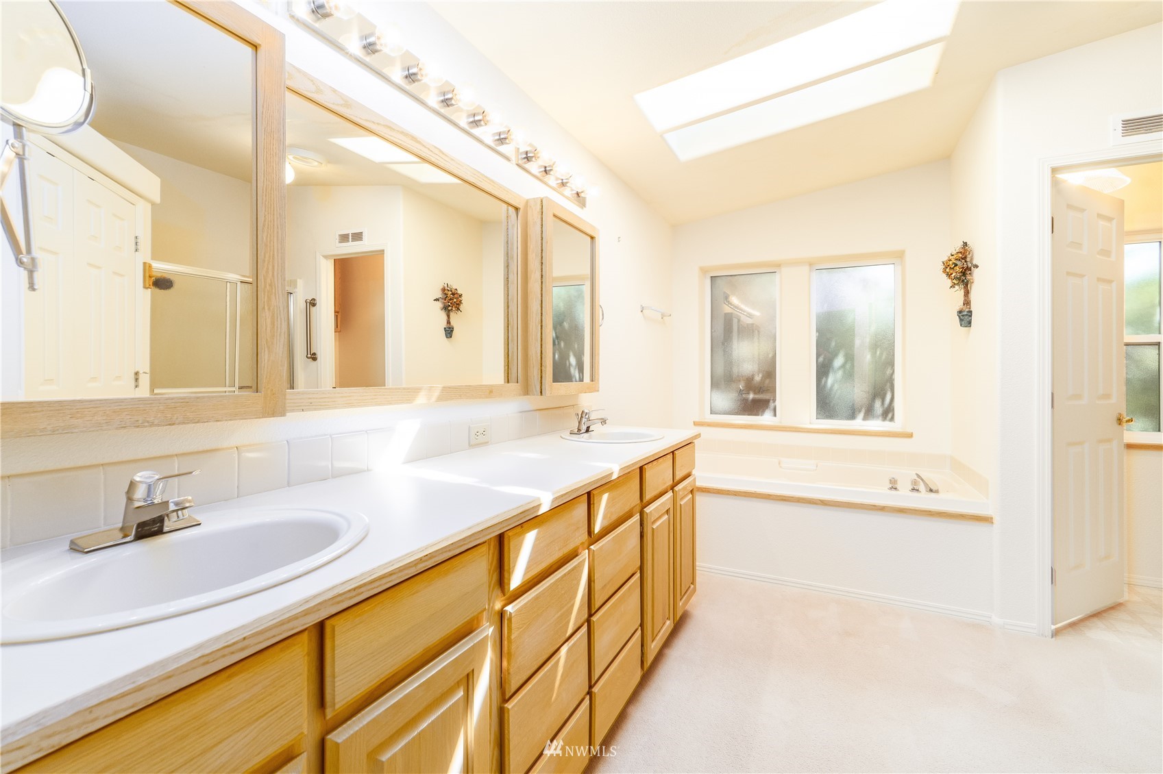 2192 Finn Hall Road Port Angeles, WA 98362 - Photo 22 of 40 a bathroom with a granite countertop sink and a large mirror