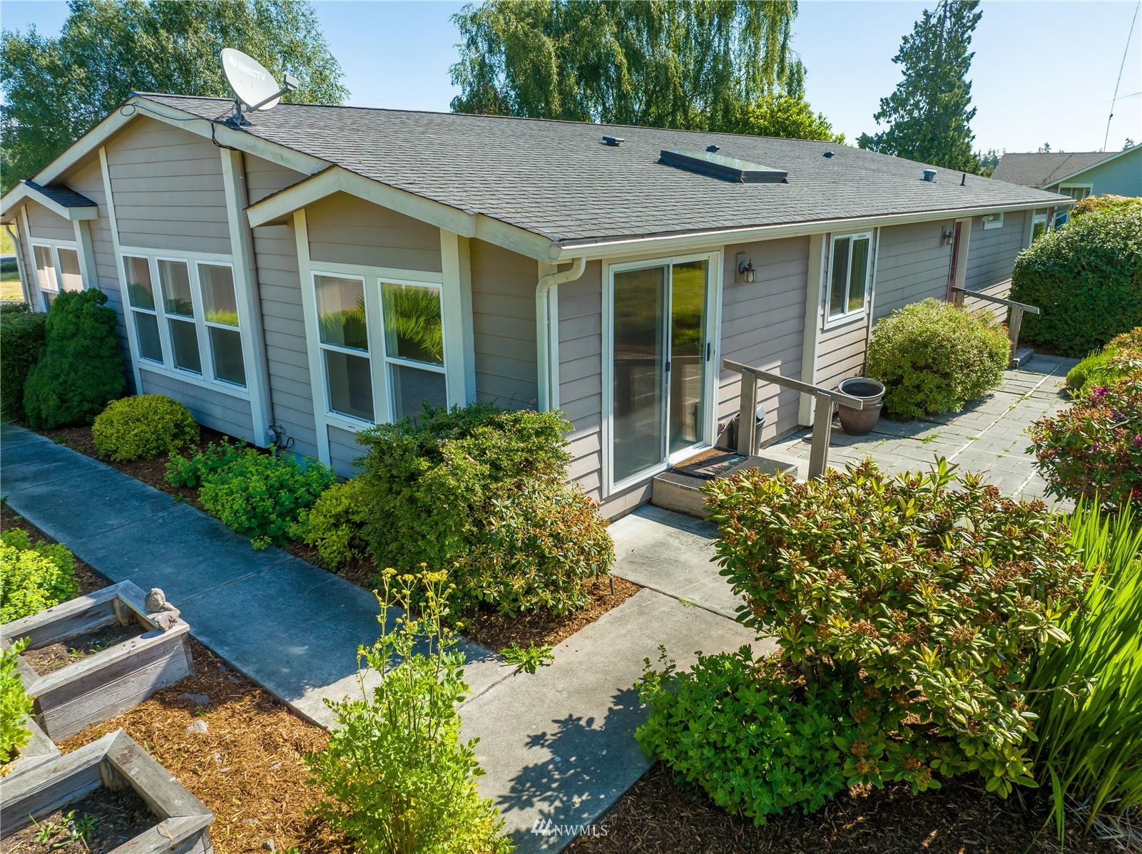2192 Finn Hall Road Port Angeles, WA 98362 - Photo 31 of 40 a front view of a house with a yard and potted plants