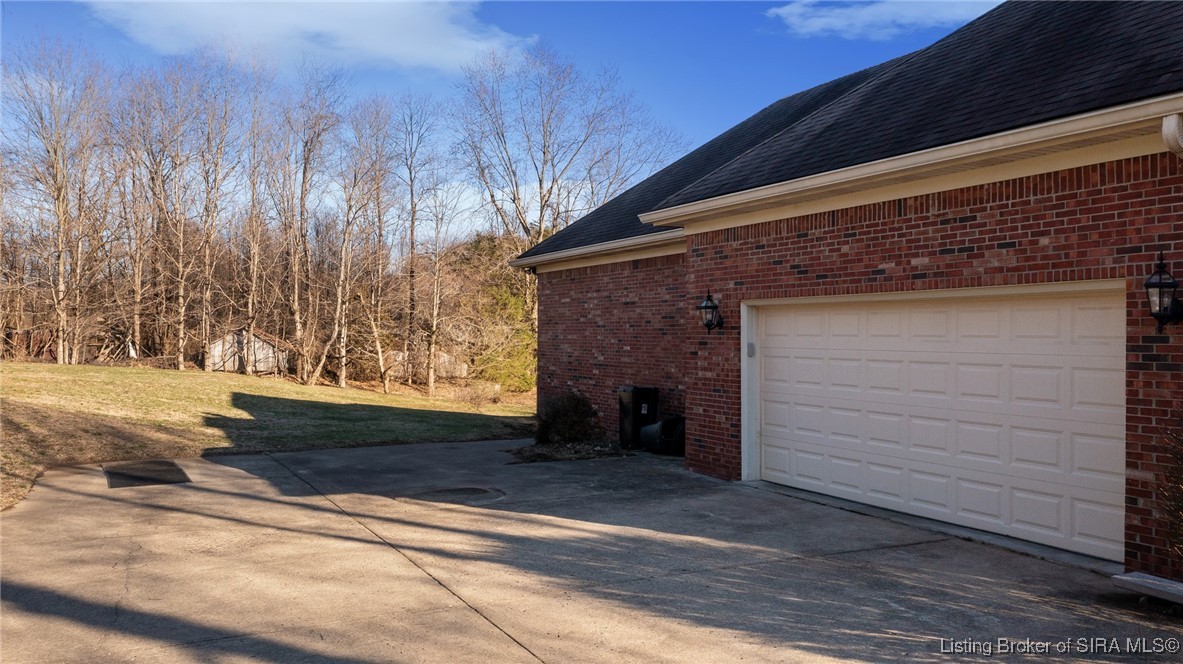 2001 Spring Creek Drive Floyds Knobs, IN 47119 - Photo 3 of 63 Side entry garage with lots of additional parking
