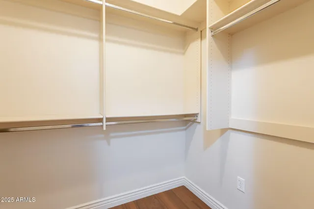 a view of an empty walk in closet