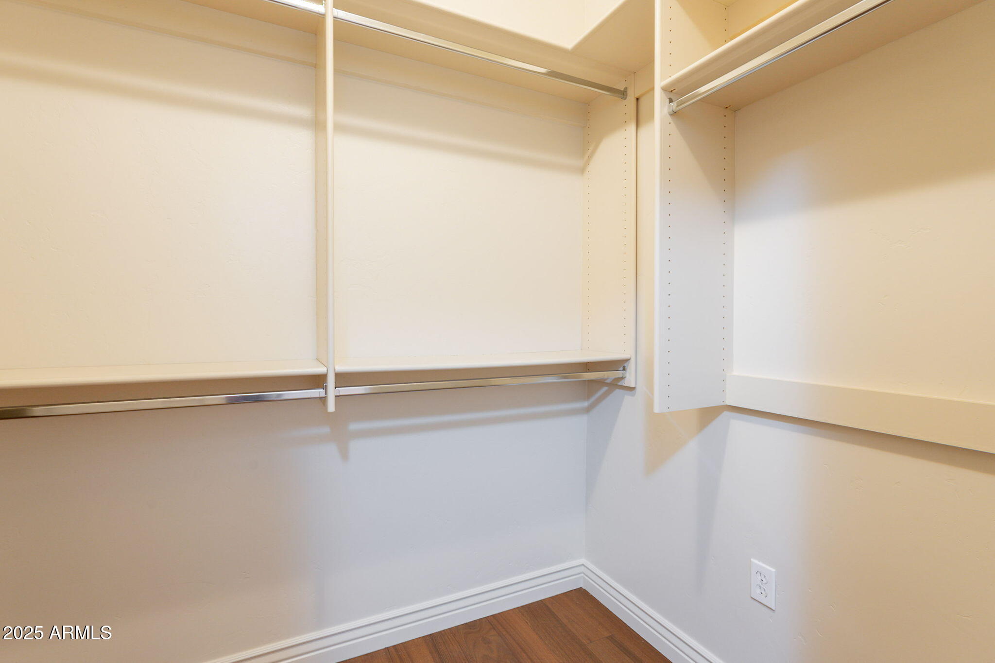 5450 East Deer Valley Drive, Unit 1208 Phoenix, AZ 85054 - Photo 14 of 36 a view of an empty walk in closet