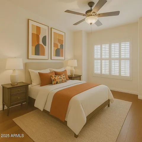 a bedroom with a bed and a painting on the wall