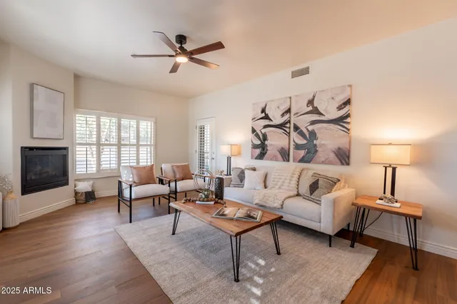 a living room with furniture and a fireplace