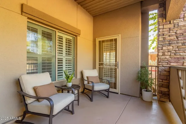 a outdoor living space with furniture and a window