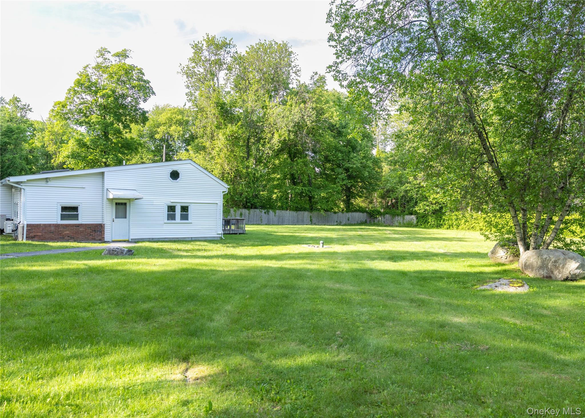 23 Lucille Road Carmel, NY 10512 - Photo 4 of 44 a front view of a house with a yard