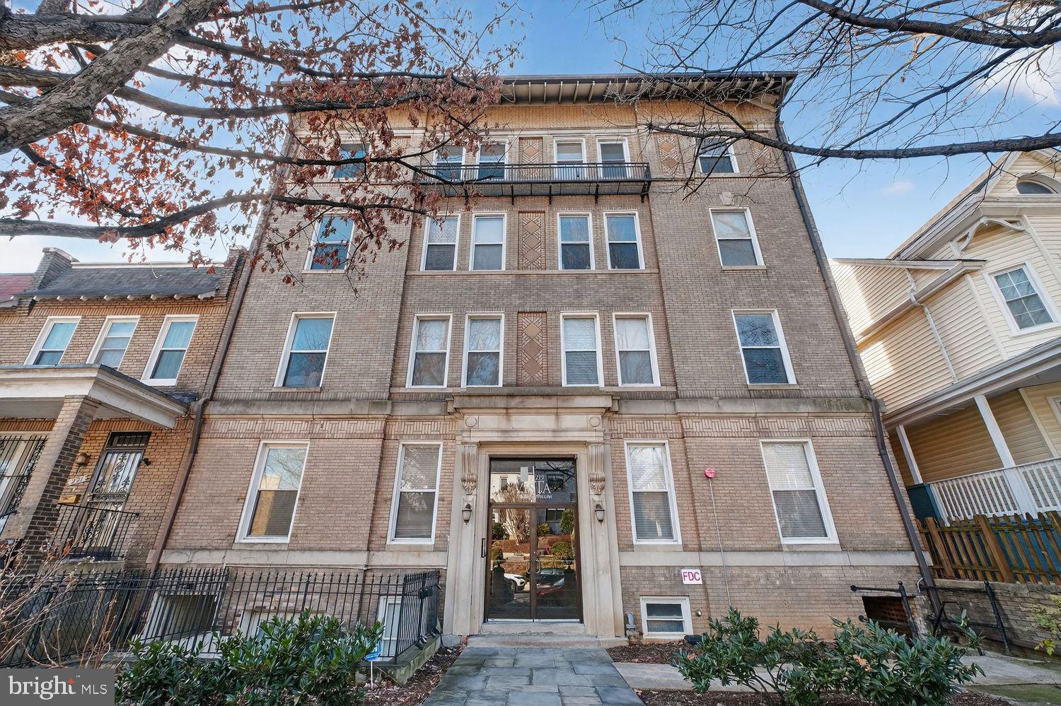 219 T Street Northeast, Unit 404 Washington, DC 20002 - Photo 1 of 24 a large building with a lot of windows