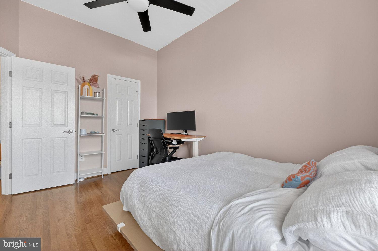219 T Street Northeast, Unit 404 Washington, DC 20002 - Photo 12 of 24 a bedroom with a bed and a flat screen tv