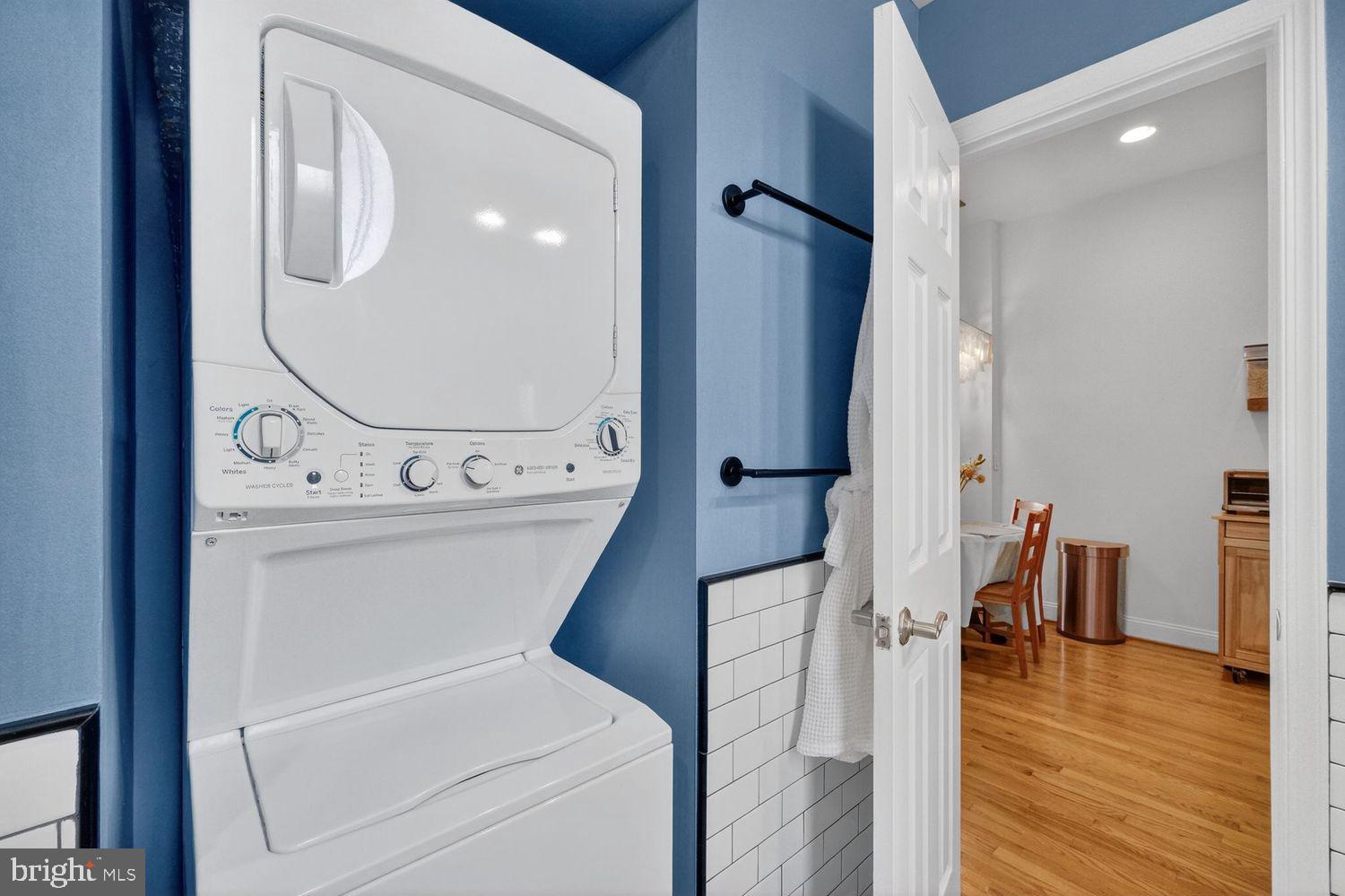 219 T Street Northeast, Unit 404 Washington, DC 20002 - Photo 16 of 24 a bathroom with a toilet sink and mirror