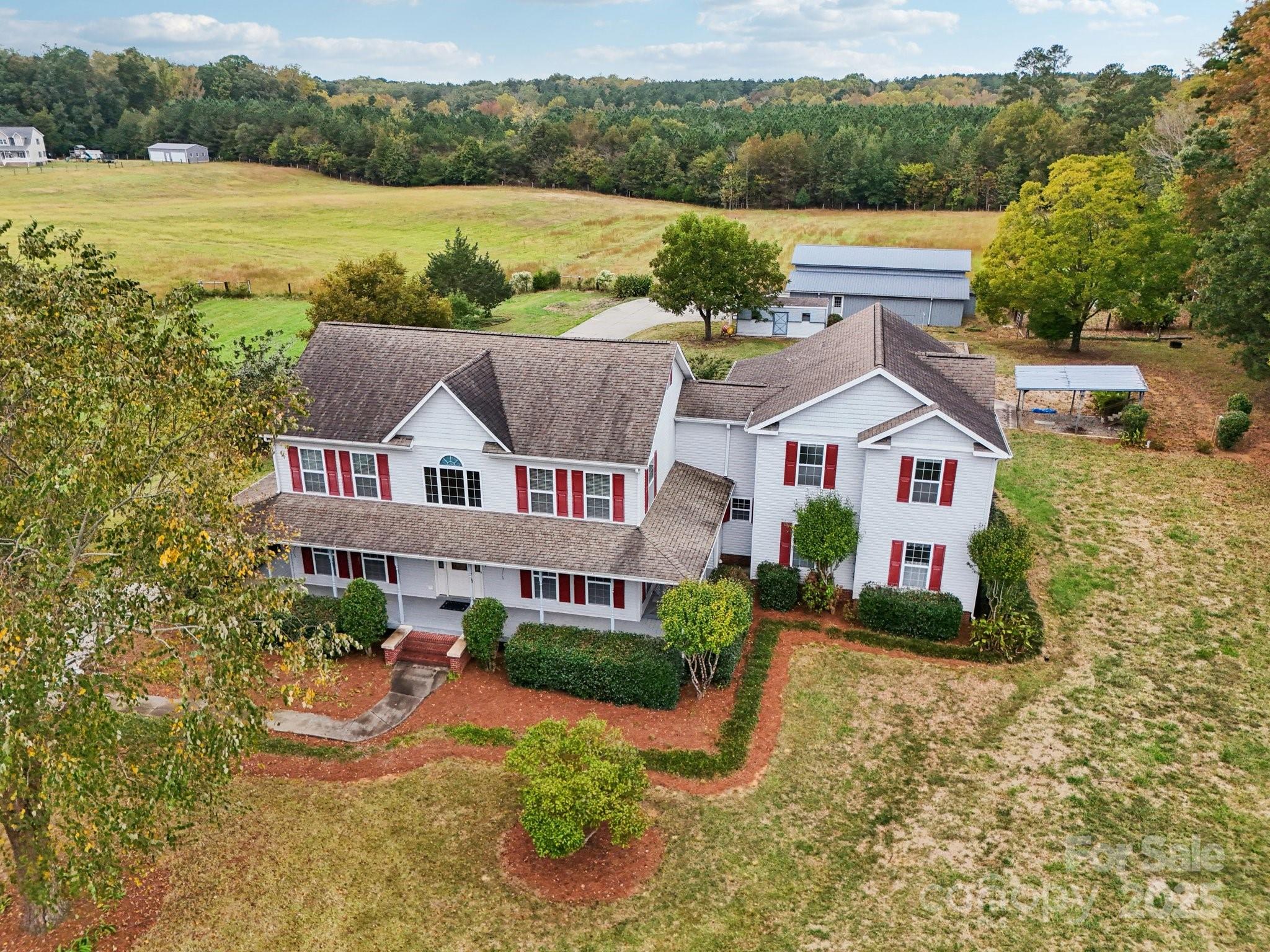 a aerial view of a house with a yard