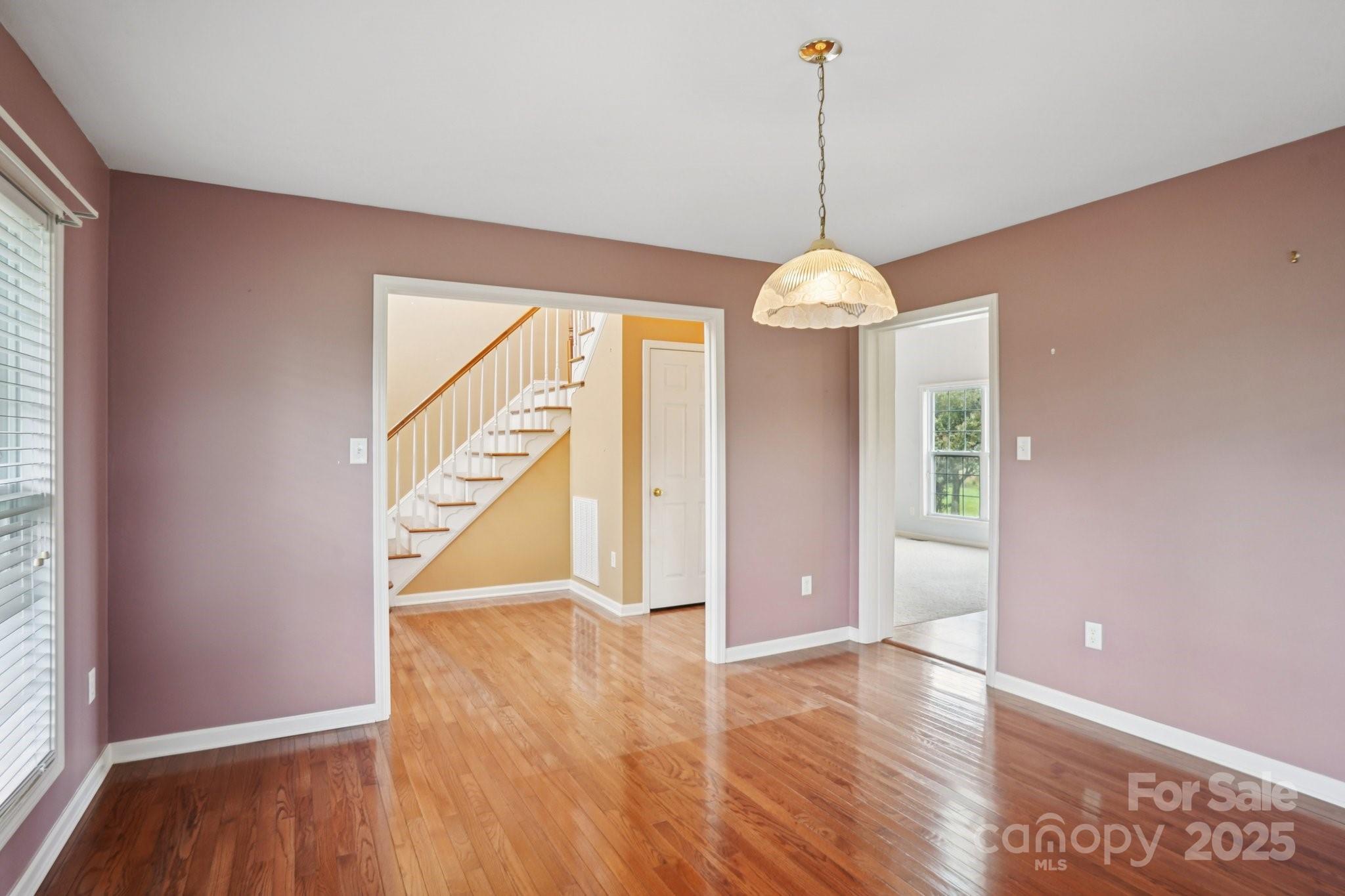 325 North Moose Road Mount Pleasant, NC 28124 - Photo 13 of 28 a view interior of a house with wooden floor windows and a chandelier