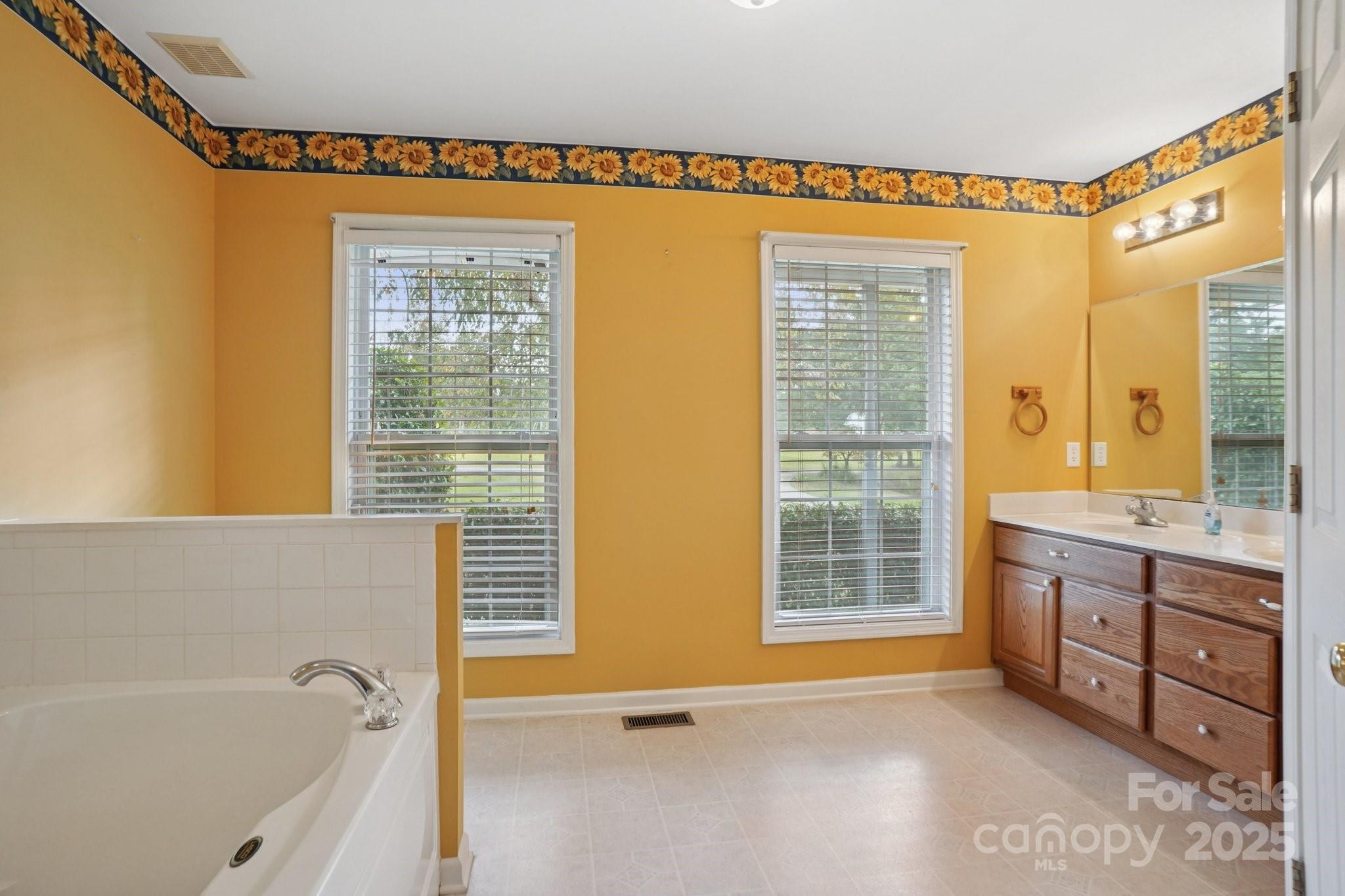 325 North Moose Road Mount Pleasant, NC 28124 - Photo 16 of 28 a bathroom with a tub sink and mirror