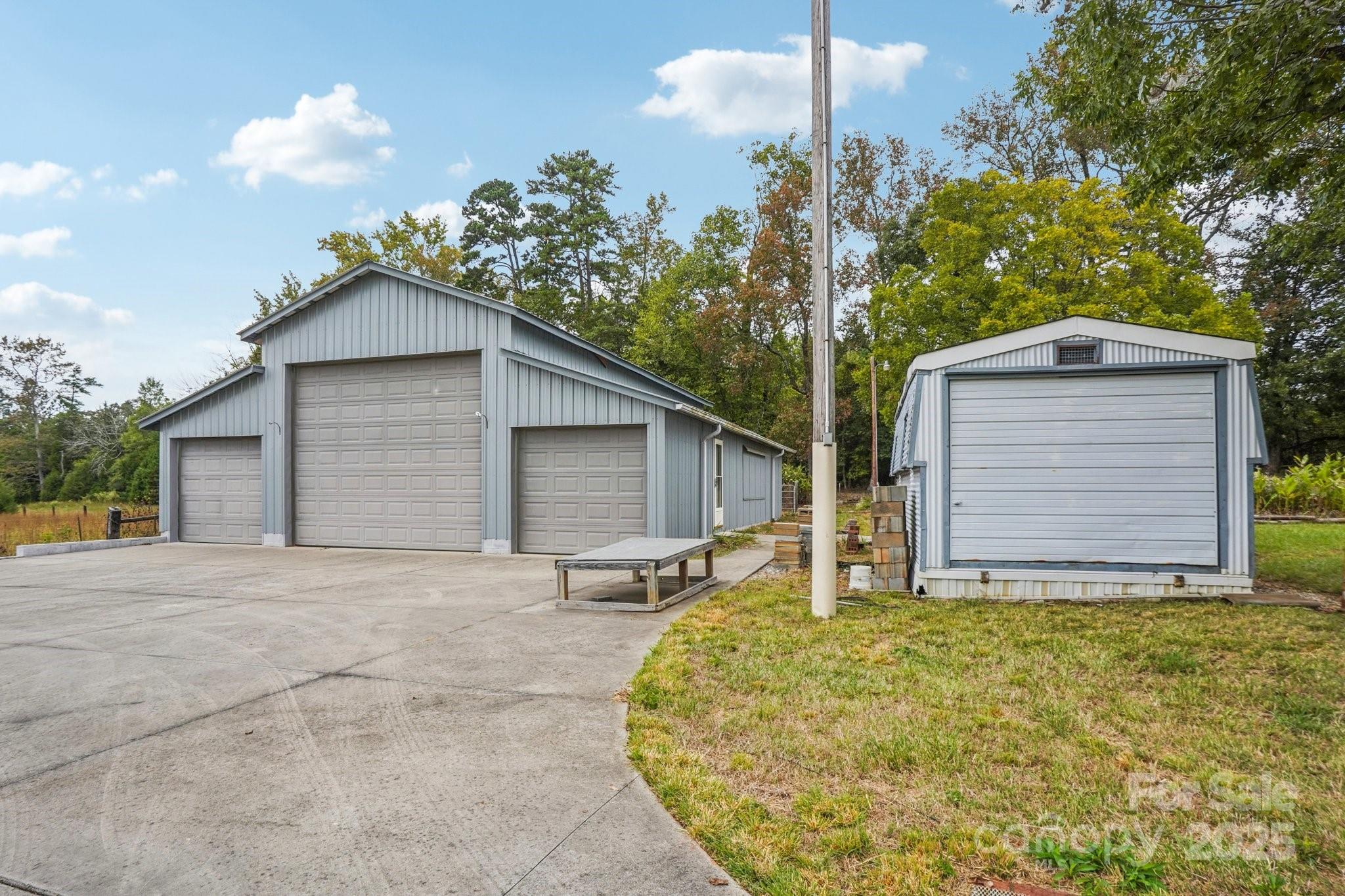 325 North Moose Road Mount Pleasant, NC 28124 - Photo 28 of 28 a view of a house with a yard and garage