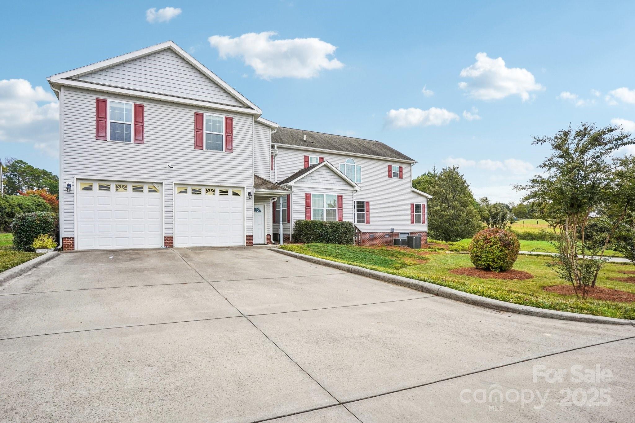 325 North Moose Road Mount Pleasant, NC 28124 - Photo 6 of 28 a view of a white house with a street