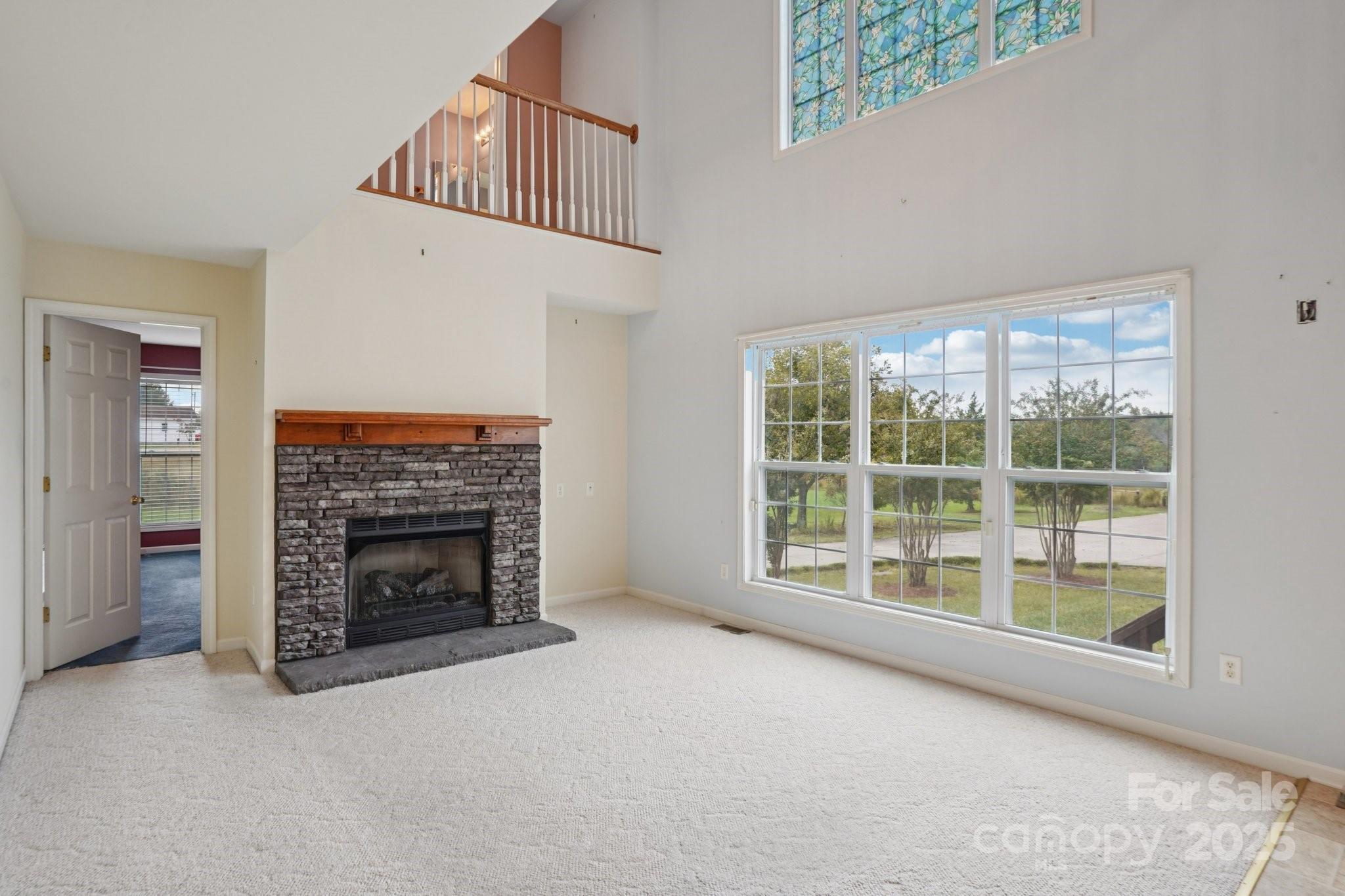 325 North Moose Road Mount Pleasant, NC 28124 - Photo 9 of 28 a view of an empty room with a fireplace and a window
