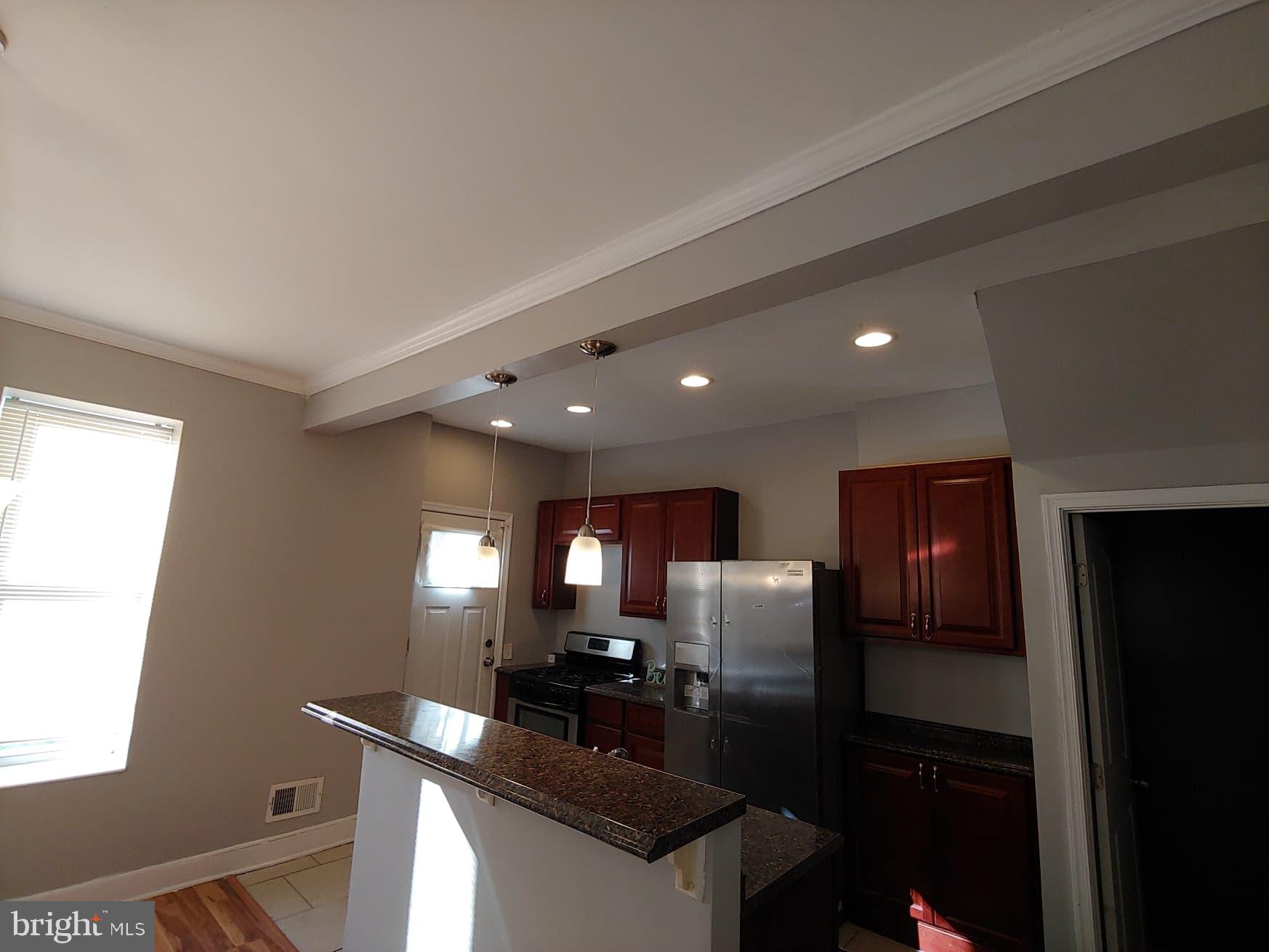 4528 Pimlico Road Baltimore, MD 21215 - Photo 4 of 20 kitchen with island for extra seating!