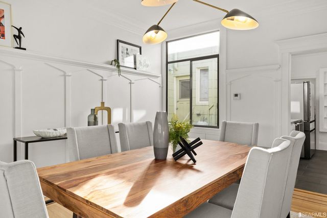 a dining room with table and chairs