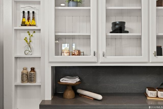 a table with a sink and wooden floor