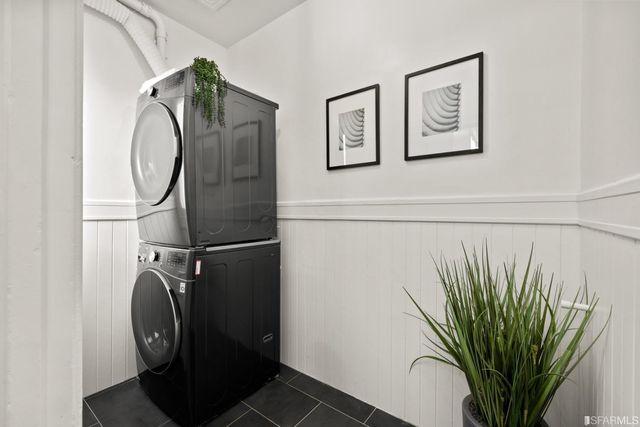 a utility room with shower and a mirror