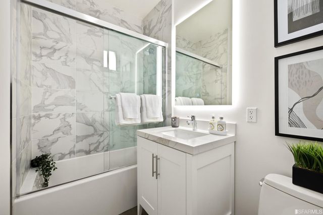 a bathroom with a sink a bathtub and a shower