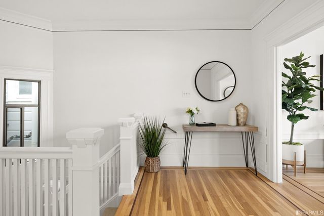 a living room with a sink and a mirror