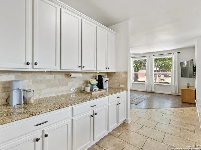a kitchen with a sink and cabinets