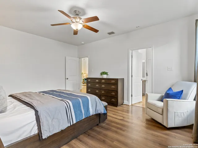 a bedroom with bed and a couch