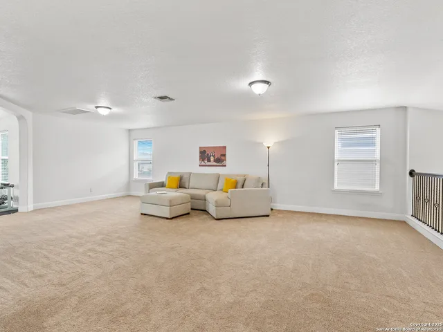 a bed room with furniture and a window