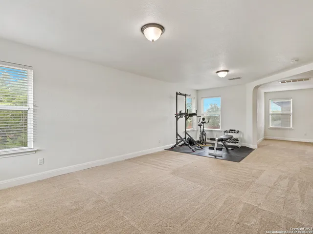 a view of a livingroom with furniture and a window