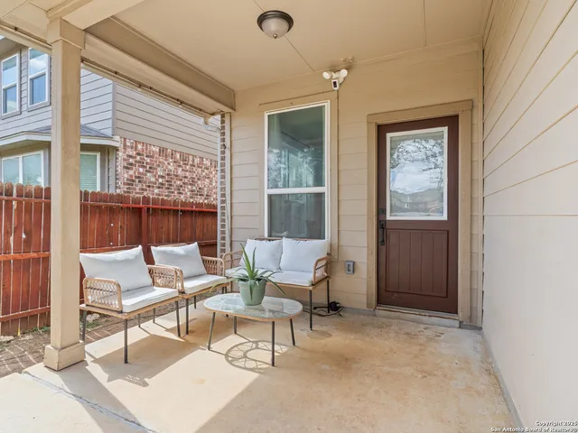 a living room with furniture and a window
