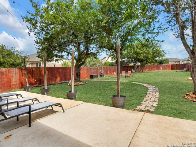 a view of a park with large trees