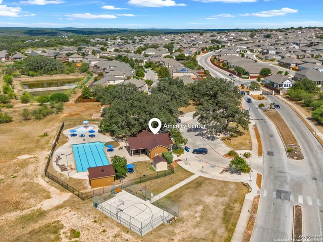 an aerial view of a house with a yard