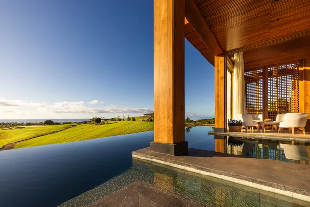a view of an outdoor kitchen with swimming pool