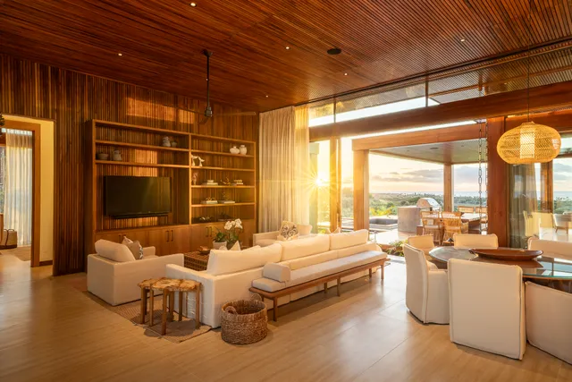 a room with furniture and large windows