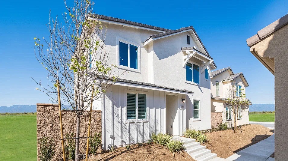 1209 Yeager Avenue Rialto, CA 92376 - Photo 17 of 20 a front view of a house with a yard