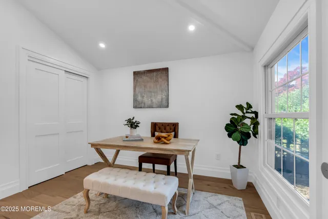 a view of a livingroom with furniture and a potted plant