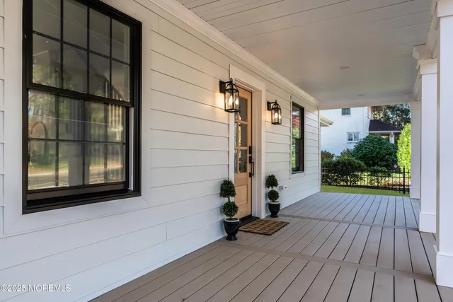 a view of front door of house with wooden floor